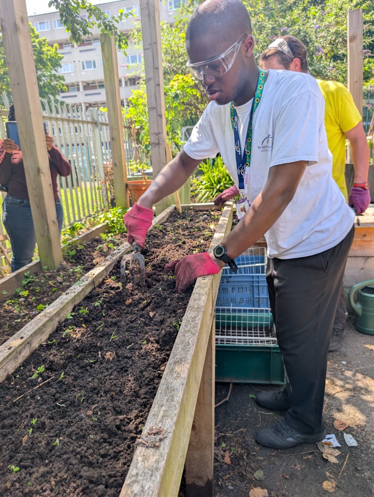 Learners watering plants in the garden