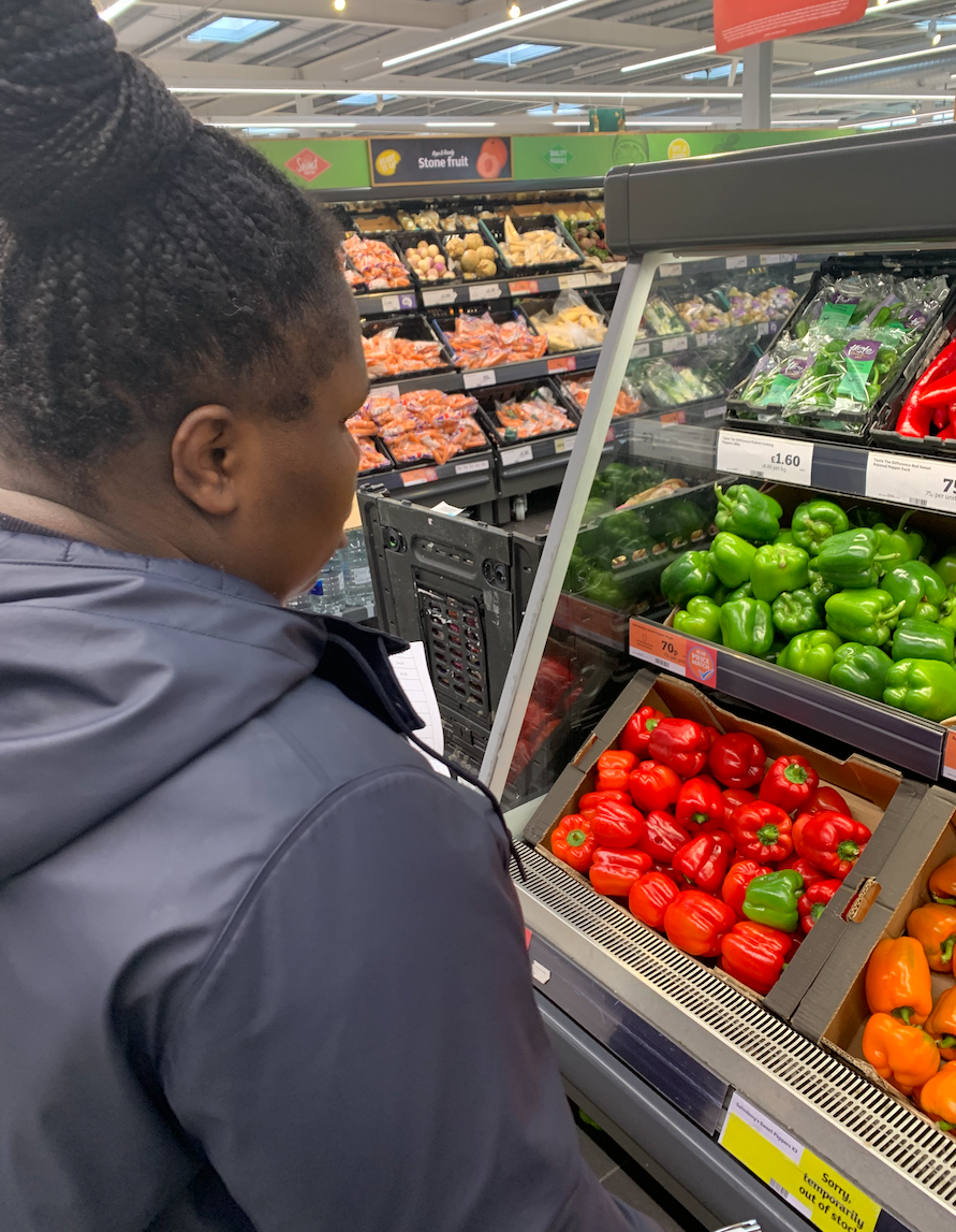 Learner choosing fresh vegetables for the café